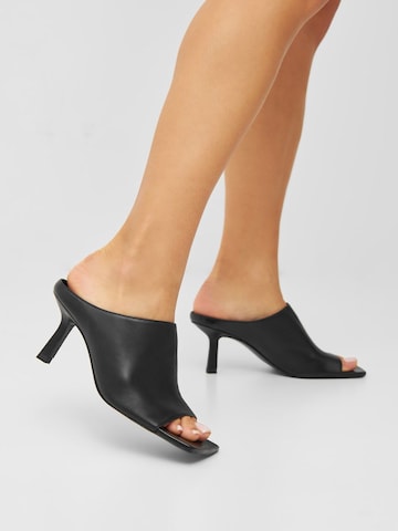 Bianco Mules in Black: front