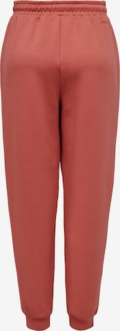 ONLY PLAY Tapered Workout Pants in Red: front