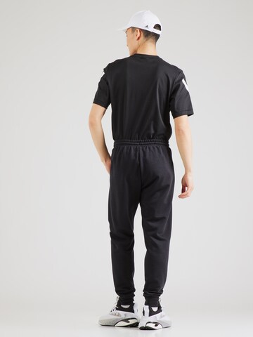ADIDAS SPORTSWEAR Tapered Sports trousers in Black