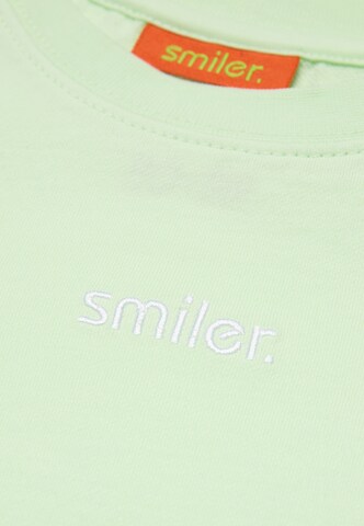 T-Shirt 'mini-laugh.' smiler. en vert