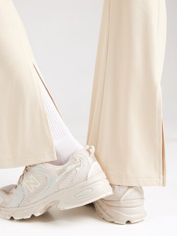 EA7 Emporio Armani Zvonový Sportovní kalhoty – šedá