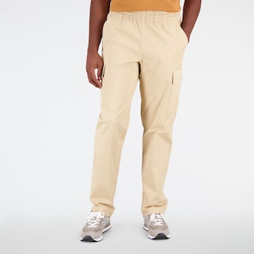 Pantalon cargo new balance en beige : devant