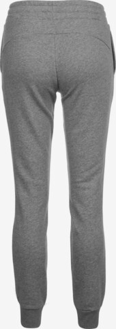 Effilé Pantalon de sport PUMA en gris