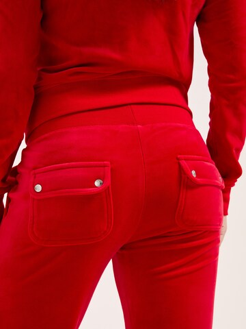 Skinny Pantaloni sportivi di Juicy Couture in rosso