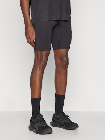 ASICS Skinny Workout Pants 'Core' in Black