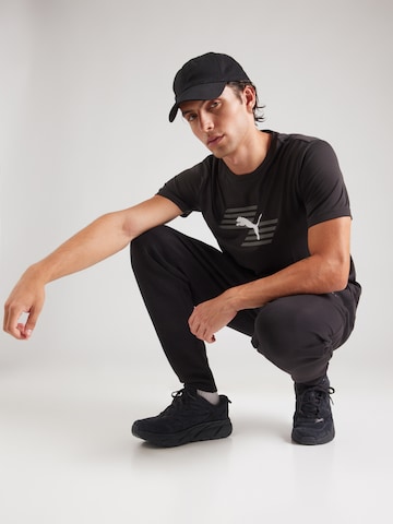 Regular Pantaloni sport de la PUMA pe negru
