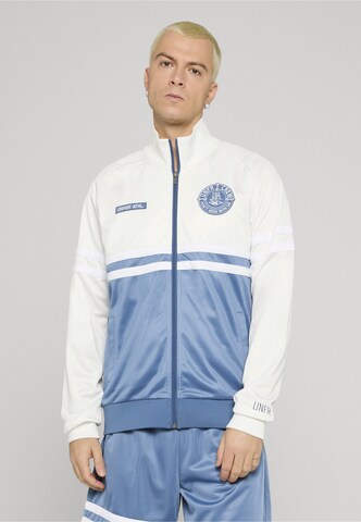 Giacca per l'allenamento 'DMWU' di Unfair Athletics in blu: frontale
