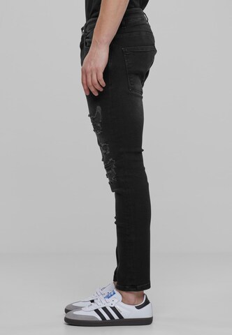 Skinny Jeans di Karl Kani in nero