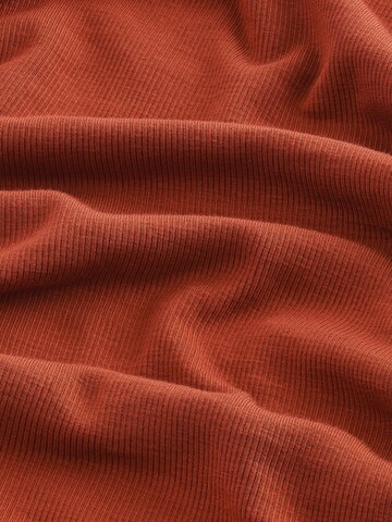 Haut Next en rouge