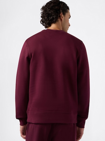 Champion Authentic Athletic Apparel - Sudadera en rojo