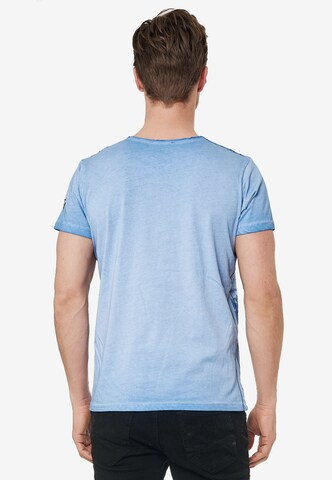 Rusty Neal Cooles T-Shirt mit Allover-Print in Blau