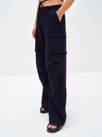 ABOUT YOU x Toni Garrn Loose fit Cargo trousers 'Dakota' in Black: front