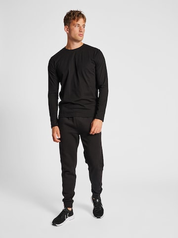 Effilé Pantalon 'Red' Hummel en noir