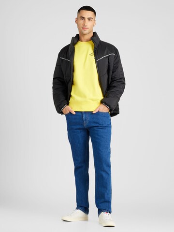 Sweat-shirt 'ARCHED VARSITY' TOMMY HILFIGER en jaune