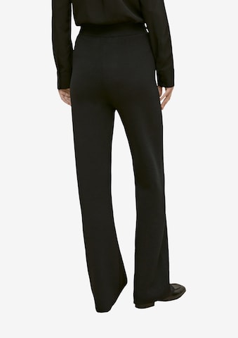 Bootcut Pantaloni de la COMMA pe negru: spate