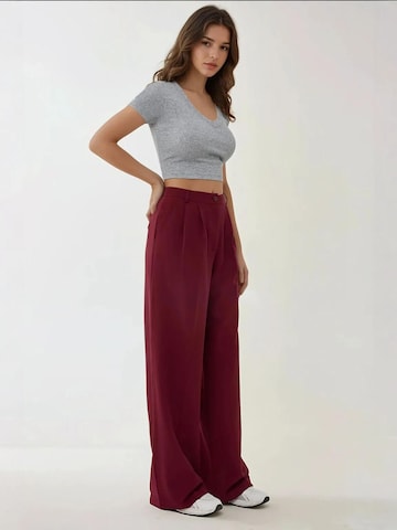 Wide leg Pantaloni con piega frontale di Hiccup in rosso