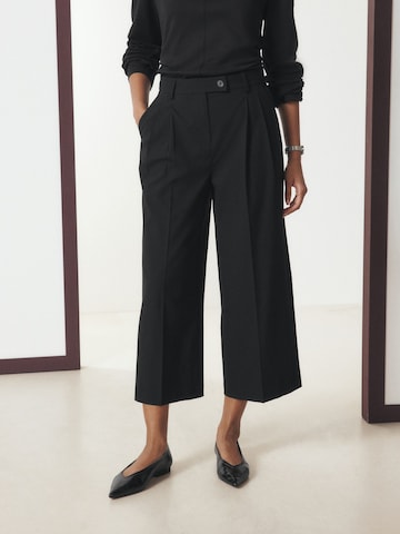 Wide leg Pantaloni con pieghe di Next in nero: frontale