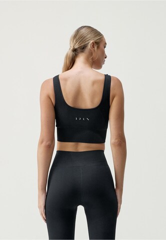 Born Living Yoga Sports Top 'Yami' in Black