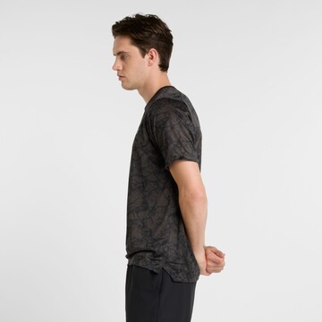new balance Functioneel shirt 'Athletics' in Zwart