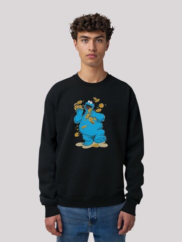 F4NT4STIC Sweatshirt 'Sesamstraße Cookie Monster Cookies Everywere' in Schwarz: Vorderseite