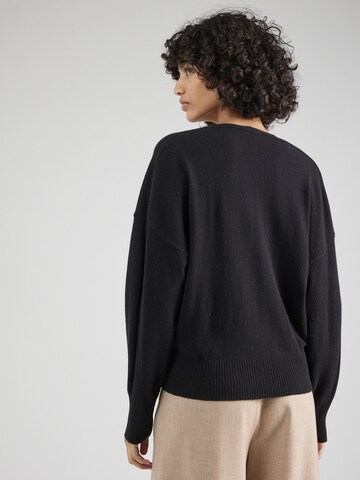 Pull-over Sisley en noir