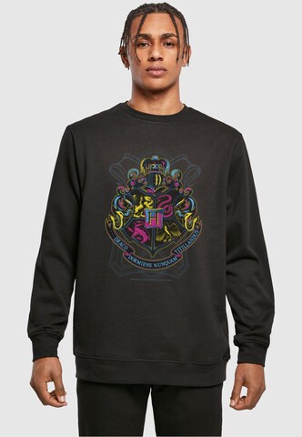 ABSOLUTE CULT Sweatshirt 'Harry Potter - Neon Hogwarts Crest' in Schwarz: Vorderseite
