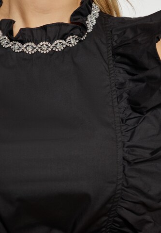 Camicia da donna di faina in nero