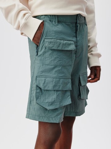ABOUT YOU x Kingsley Coman Regular Cargo trousers 'Theo' in Green