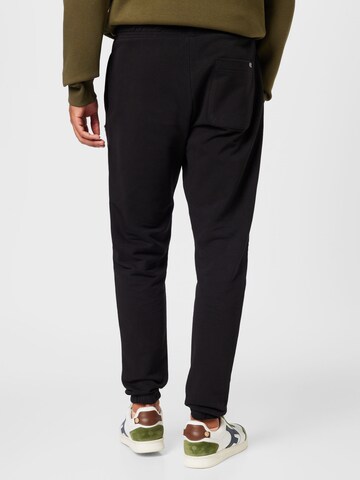 Tommy Jeans Tapered Hose in Schwarz