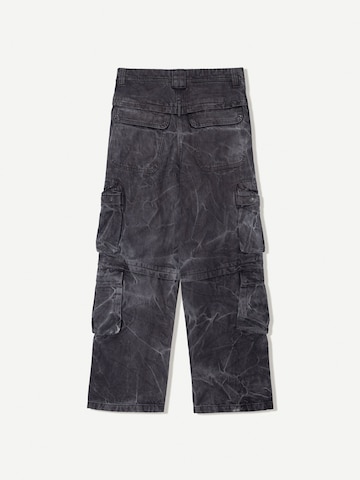 Bershka Baggy Džíny s kapsami – černá