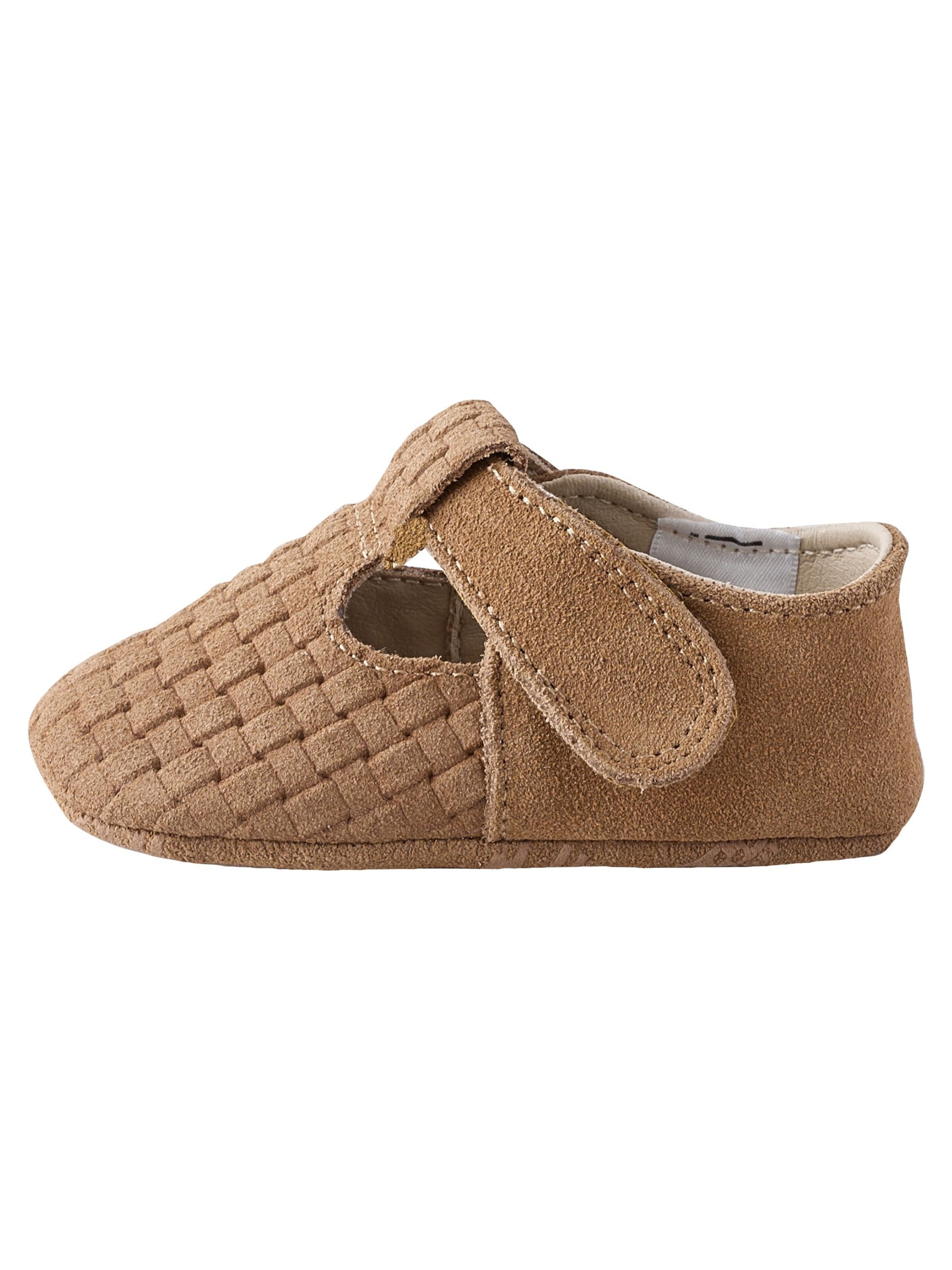 Next Nyfödd i brun: framsida