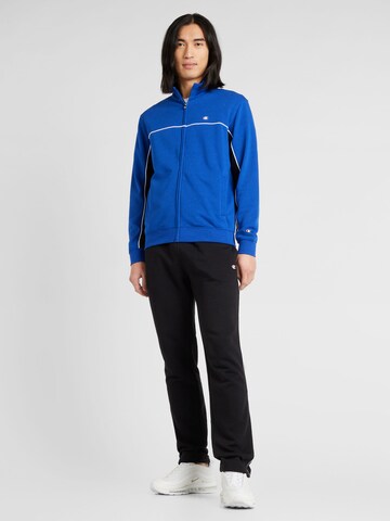 Champion Authentic Athletic Apparel Tracksuit in Blue: front