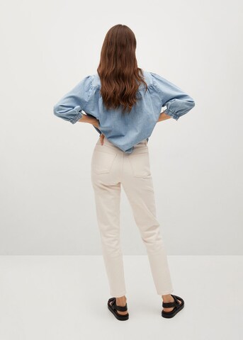 MANGO Zwężany krój Jeansy w kolorze biały