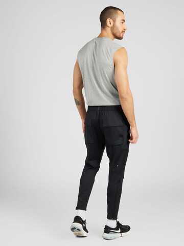 Tapered Pantaloni sport 'DFADV AXIS' de la NIKE pe negru