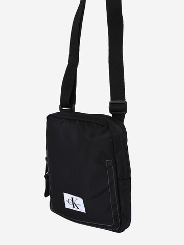 Sac à bandoulière Calvin Klein Jeans en noir : devant