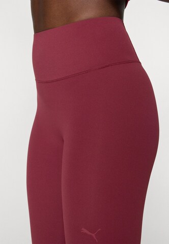 PUMA Skinny Sports trousers in Red