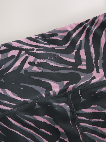 Skinny Pantaloni sportivi di Next in rosa