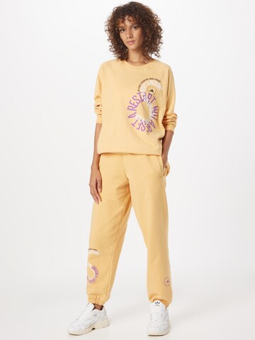 Loosefit Pantalon de sport ADIDAS BY STELLA MCCARTNEY en jaune