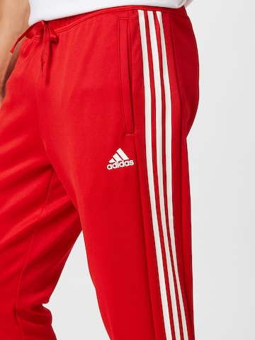 ADIDAS SPORTSWEAR Slimfit Urheiluhousut 'Tiro Suit-Up Lifestyle' värissä punainen