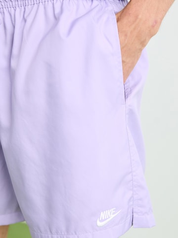 Nike Sportswear Loose fit Trousers 'CLUB' in Purple