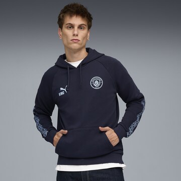PUMA Sportsweatshirt 'Manchester City King' in Blauw: voorkant