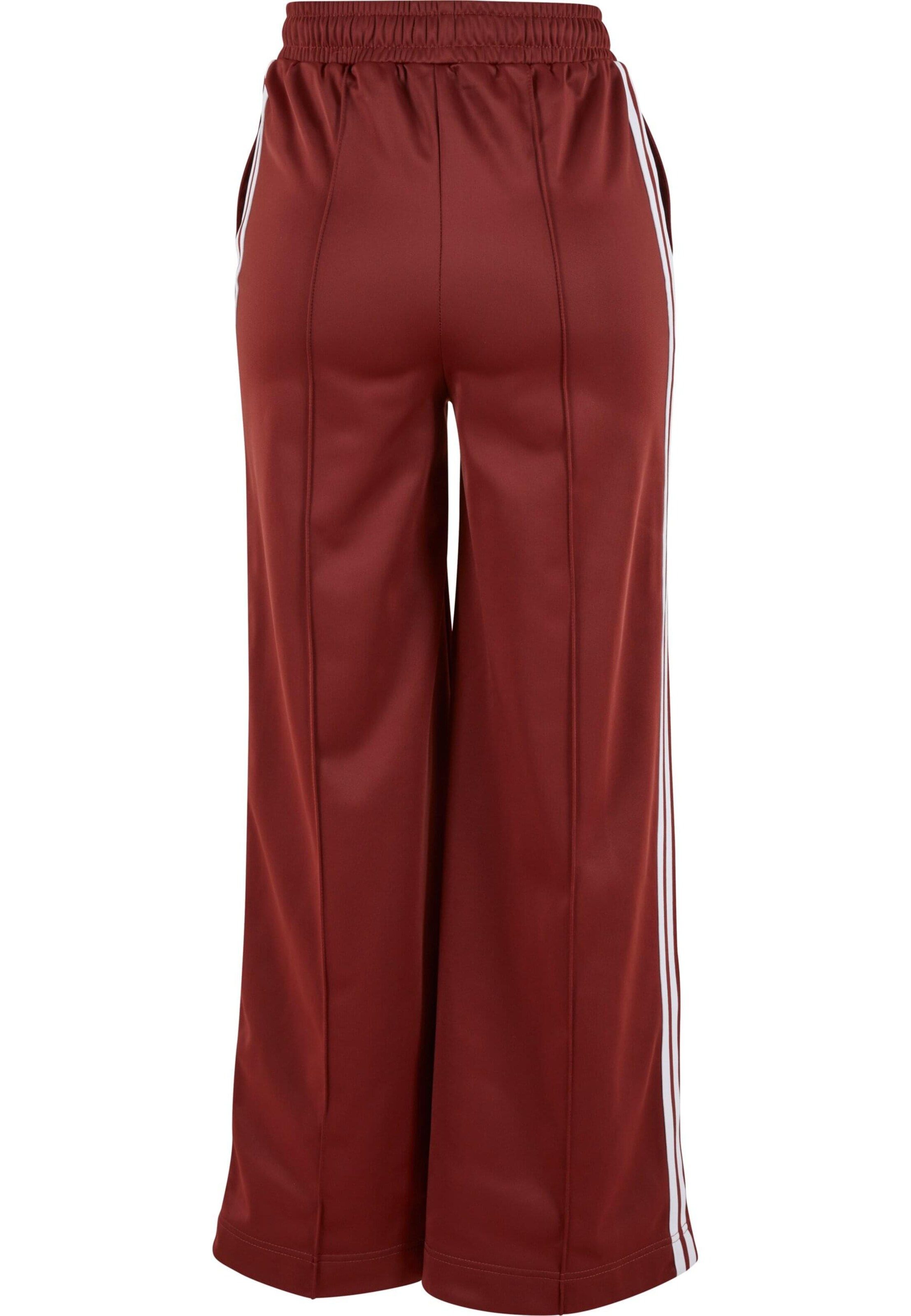 Wide leg Pantaloni di Urban Classics in rosso