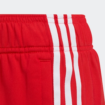 ADIDAS ORIGINALS Tapered Παντελόνι 'Adicolor Sst' σε κόκκινο