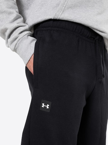 UNDER ARMOUR Tapered Παντελόνι φόρμας 'Rival' σε μαύρο