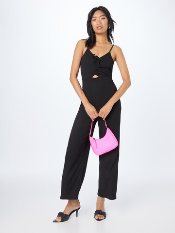 Tuta jumpsuit 'Penelope' di ABOUT YOU in nero