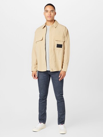 Calvin Klein Jeans Between-season jacket 'ESSENTIAL' in Beige
