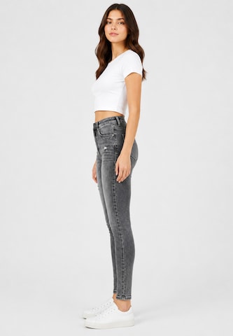 Skinny Jeans di Elara in grigio