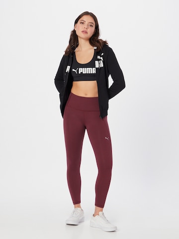 PUMA Skinny Sports trousers in Purple