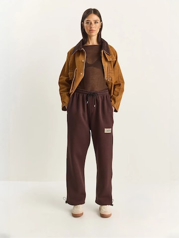 Bianco Lucci Loose fit Trousers in Brown: front