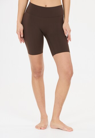 Athlecia Skinny Sportbroek 'Emarri' in Bruin: voorkant